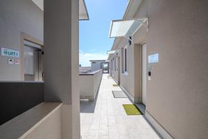 an empty hallway of a building with a view at SPACE101 City Apartment & Studio in Limito di Pioltello