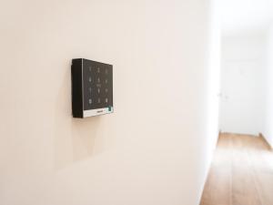 a switch on the side of a white wall at La Martina Guesthouse in Angri +39 photos