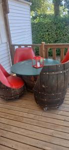 a table and two chairs on a deck at Far west location in Vironchaux +2 photos