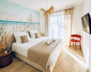 a bedroom with a large bed and a large window at Villas Vallée d'ASCO in Moltifao +70 photos