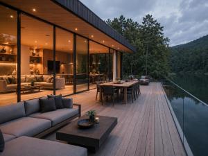 a house on a wooden deck with a view of the water at De Holiday Home in Haenertsburg