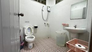 a bathroom with a toilet and a sink at Rose bungalow at Ya Nui beach in Nai Harn Beach
