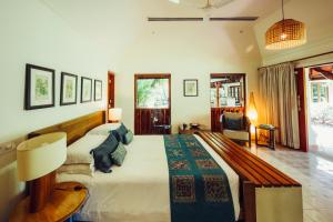 a bedroom with a large bed in a room at Indian Summer House in Mūvattupula
