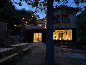 a house with a picnic table in front of it at Camping Pier10 in Bourscheid +35 photos