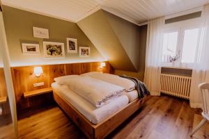 a bedroom with a large bed in a room at Schiebenrothenhof in Simonswald