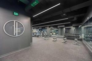 a gym with rows of chairs and a mirror at CozySuites at Sky Central in Cincinnati +70 photos