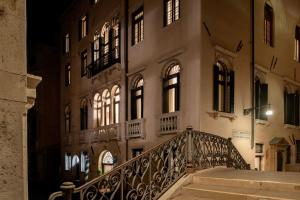 a building with a staircase in front of a building at Eight Venezia in Venice