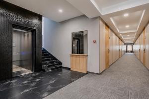 an empty hallway with a staircase in a building at Auris Hotel & Restobar in Almaty