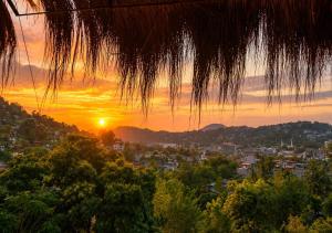 a view of the sunset from a tree at Giripura Resort - Kandy in Kandy