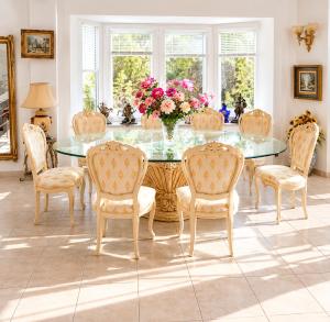 a dining room with a glass table and chairs at Mijas Villa Doña Pilar Pool & Jacuzzi in Mijas