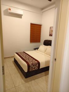a bedroom with a bed in a room at Afa Homestay Melaka in Malacca