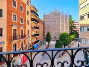 a view from a balcony of a city with buildings at Apartamentos Mantería Lacort, Valladolid in Valladolid