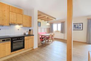 a kitchen with a table and a dining room at Banders Landhaus in Imst