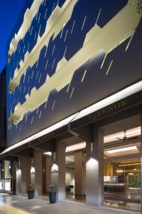 a building with an american flag painted on it at Hotel Lozenge in Athens