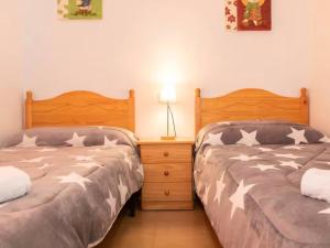two beds sitting next to each other in a bedroom at Casa en Riumar in Riumar +20 photos