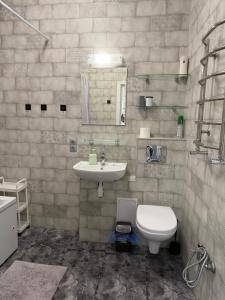 a bathroom with a toilet and a sink at Французский Бульвар ЖК Париж in Odesa +32 photos