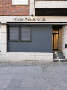 a hospital melbourne sign on the side of a building at Hostal Majadahonda in Majadahonda