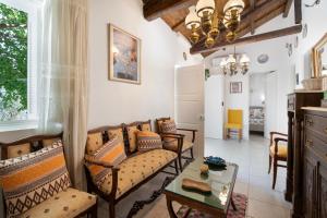 a living room with a couch and a table at Giannis Mountain House in Aigio