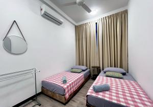 a room with two beds and a mirror at MySky Putrajaya in Putrajaya +155 photos
