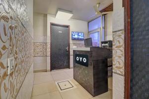 an office with aiya sign on the wall in a room at Collection O The Legend Hotel, Hisar in Hisār +21 photos