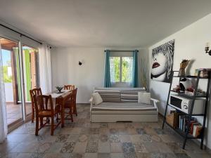 a living room with a couch and a table at Dafne's Beach in La Pineda