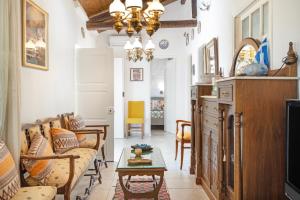 a living room with a couch and a table at Giannis Mountain House in Aigio