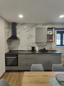 a kitchen with a stove and a counter top at Gondar Stays T2  +5 photos
