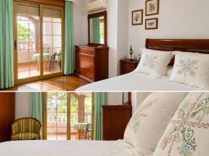 a bedroom with a bed and a balcony at Casa de los Yayos in Vélez de Benaudalla