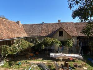 a house with a table in front of it at Bavaria One in Cincu