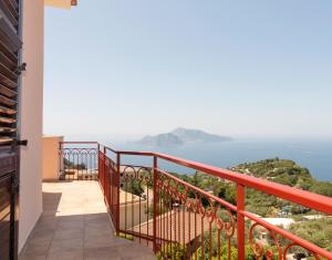 a balcony with a view of the ocean at Sunset Capri by Espresso Rentals in Massa Lubrense +14 photos
