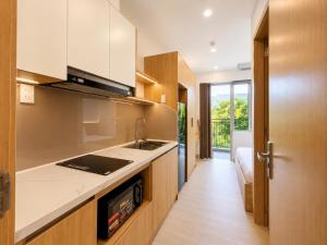 a kitchen with a sink and a counter top at Minh Khang Apartment in Danang