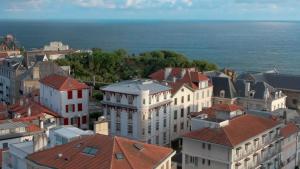 an aerial view of a city with buildings and the ocean at Maison Atalaye - Hôtel entièrement rénové in Biarritz