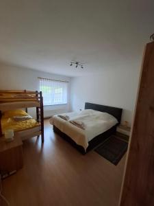 a bedroom with two bunk beds and a window at Haus-Sonnenschein - Lausitzer Seenland - Senftenberger See in Senftenberg +31 photos