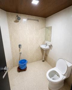 a bathroom with a toilet and a sink at Hotel Sundaram 5 Minutes Distance from Dargah in Ajmer