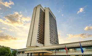 a tall building on top of a building at Astoria Grand Hotel in Sofia