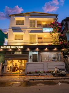 a scooter parked in front of a guest house at Lake Land Guest House in Kolkata