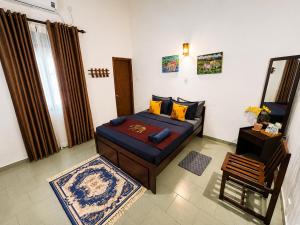 a living room with a couch in a room at PearlDrop Hills Kandy in Kandy