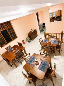 an overhead view of a dining room with wooden tables and chairs at PearlDrop Hills Kandy in Kandy