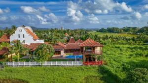 an aerial view of a house with a white fence at Cathaya Private Pool Villa - Limasan Padi in Langkawi Intl