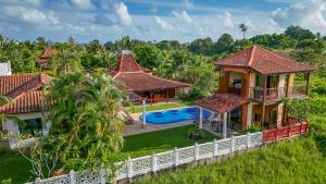 an aerial view of a house with a swimming pool at Cathaya Private Pool Villa - Limasan Padi in Langkawi Intl