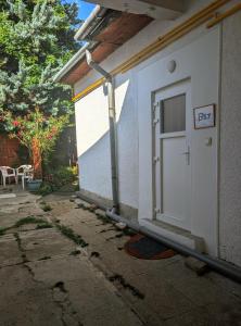 a door on the side of a house at B57 guesthouse in Budakalász +3 photos