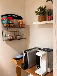 a desk with a computer monitor and a printer at s'Morent in Zöblen