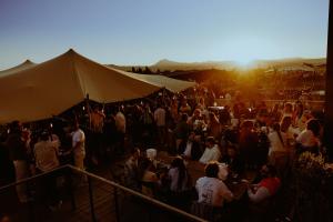 a large crowd of people standing around a tent at Grand Mess Clermont-Ferrand in Clermont-Ferrand