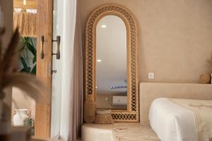 a room with a mirror and a bed and a tub at Gili Boho Villas - Aesthetic Private Pool Villas in Gili Trawangan +37 photos