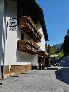 a building with flower boxes on the side of it at Hotel Buckelhof - See - Free Liftpass Summer in See
