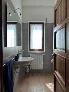 a bathroom with a sink and a mirror at Villa Nina in Caporciano +13 photos