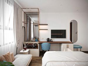 a hotel room with a bed and a desk at Ben Thanh Luxury Hotel - Premium Kas Dilly & Spa in Ho Chi Minh City