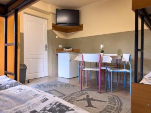 a kitchen with a table and chairs in a room at Hostel Relax in Warsaw