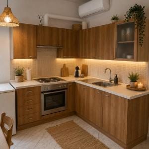 a kitchen with wooden cabinets and a sink at Olga Dova Apartments in Ioannina