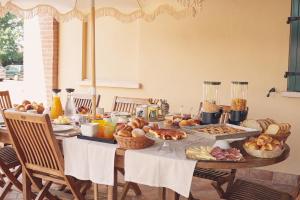 a table with a bunch of food on it at Villa Anastasia in Carpi +26 photos